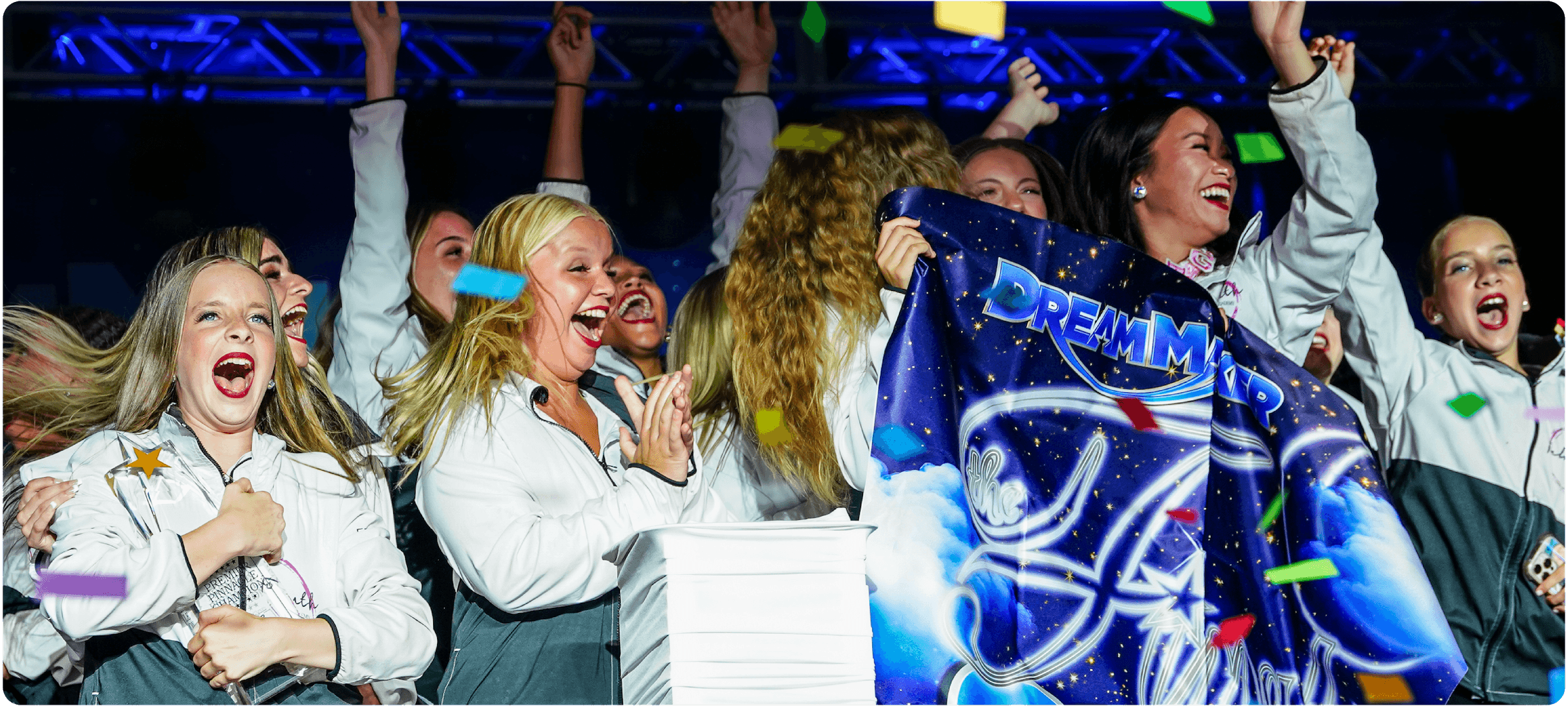 DreamMaker dancers celebrating on stage